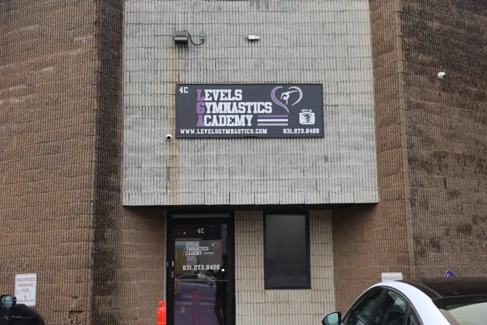 Gymnastics academy building exterior sign